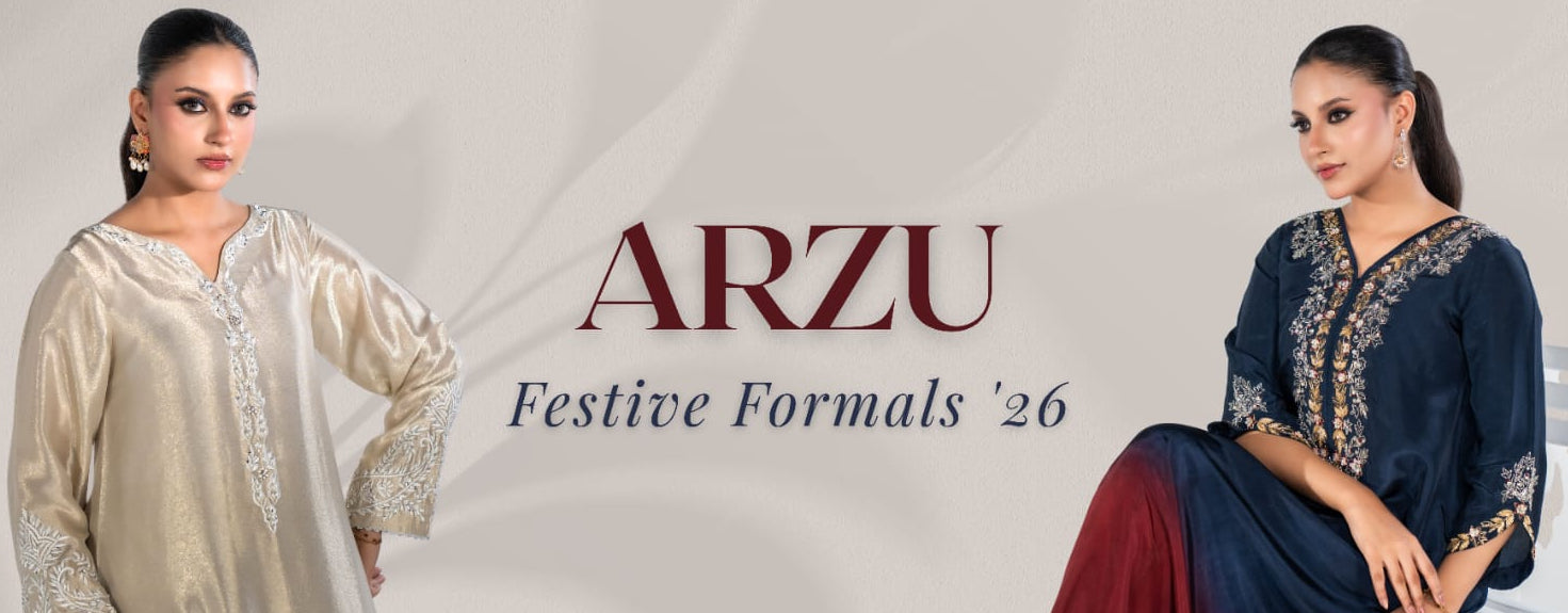 Two models display traditional South Asian formal wear from the brand ARZU, featuring a cream-beige tunic with silver embroidery on the left, and a navy blue tunic with gold embroidery and a maroon skirt on the right. The text 'ARZU Festive Formals '26' is displayed in the center against a light beige background.